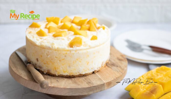 Easy Mango Cheesecake Dessert recipe to make with cream cheese and lemon and biscuit base. No Bake creamy filling with mango slices.