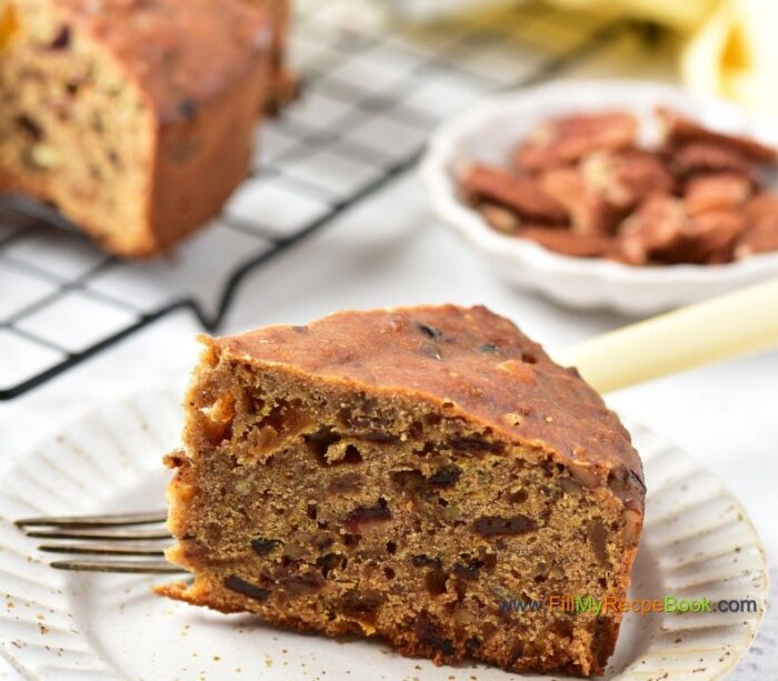 Festive Cranberry Christmas Fruit cake recipe with pecan nuts a glaze of orange juice. Light, moist and alcohol free, simple bake for the holidays.