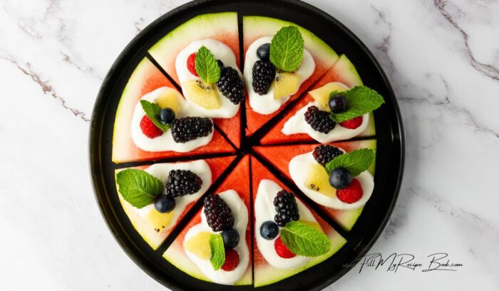 Easy, healthy watermelon berry pizza recipe topped with Greek yogurt and honey, made in minutes with no added sugars for snacks.