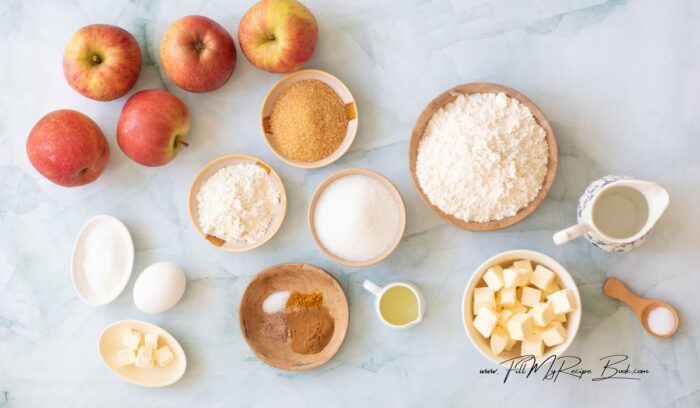 Ingredients for the apple pie and double crust recipe idea, applecrisp apples, sugars, brown and white, cinnamon, butter, egg, flour, salt and lemon juice to prevent the apples from browning.