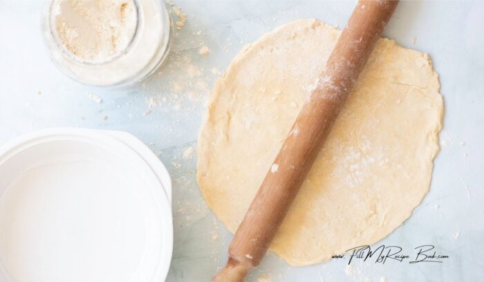 On a lightly floured surface, roll out the dough into a circle large enough to fit into a 9-inch pie dish. 