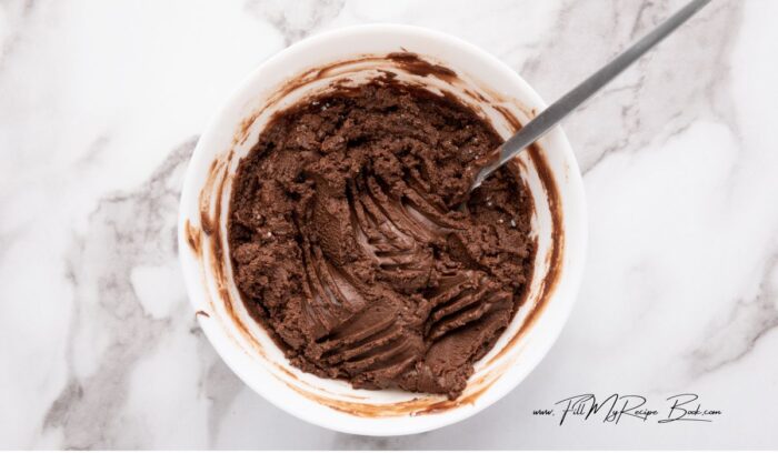 In a microwavable bowl, combine Nutella and butter, and microwave for about 30 seconds or until the butter has melted. Stir until well combined. Add powdered sugar to the Nutella mixture and mix again.