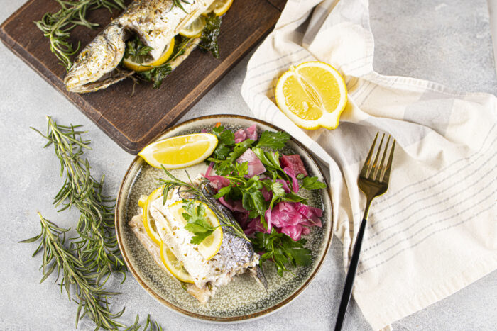 Simple Oven Baked Sea Bass Recipe idea. A whole fresh sea bass fish baked in a dish for a healthy dinner or lunch with sides of choice.