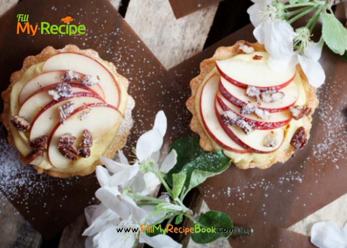 Mini Apple Cream Tartlets recipe with baked shortbread pastry for tarts. Filled with creamed apple sauce, slices of fresh apples for dessert.