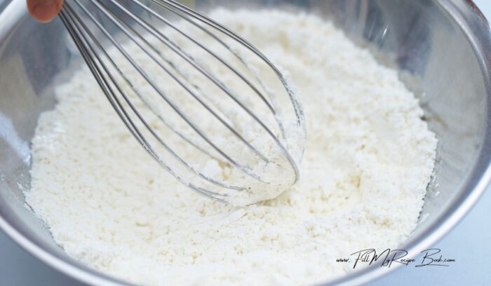 whisk up the flour to lighten it to cook better and make delicious 3 ingredient verkoeks.