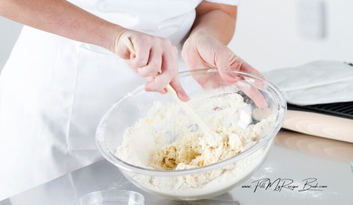 mixing the greek yogurt with the flour to make an easy dough for a 3 ingredient vetkoek idea.