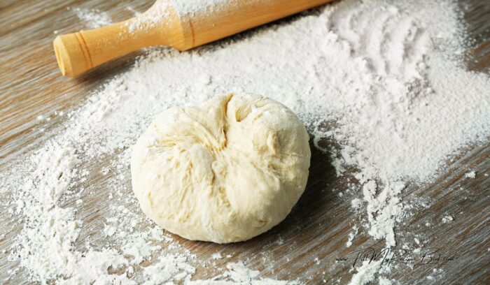 with your hands roll the dough into a ball to cut into equal balls for the vetkoek you want to fry.