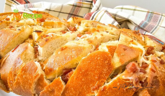 Savory Bacon Cheese Pull Apart Bread recipe. Simple appetizer or starter to bake with a ready made loaf of bread, using garlic and butter.