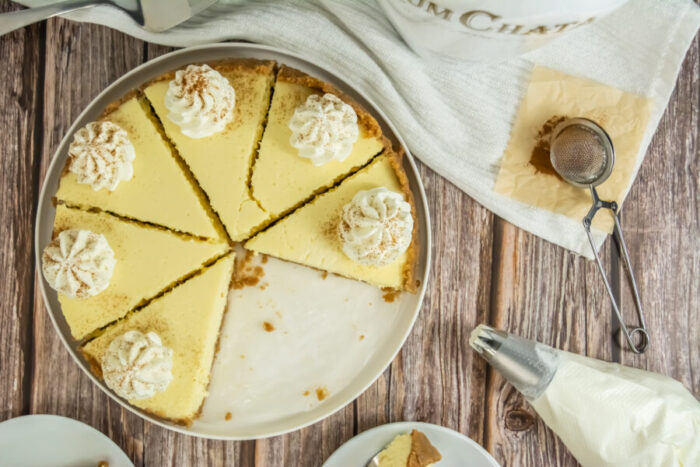 Easy Rumchata Cheesecake Recipe idea. Oven Baked with biscuit base and creamy liqueur flavor with cinnamon and cream topping for dessert.