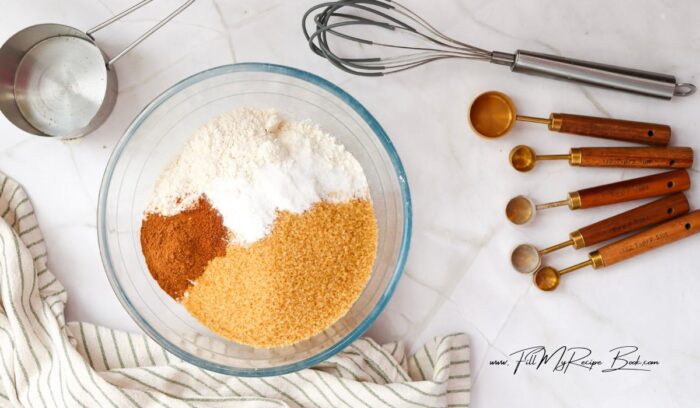 Prepare the Dry Ingredients. In a large bowl, whisk together the flour, brown sugar, baking powder, baking soda, cinnamon, nutmeg, and salt.