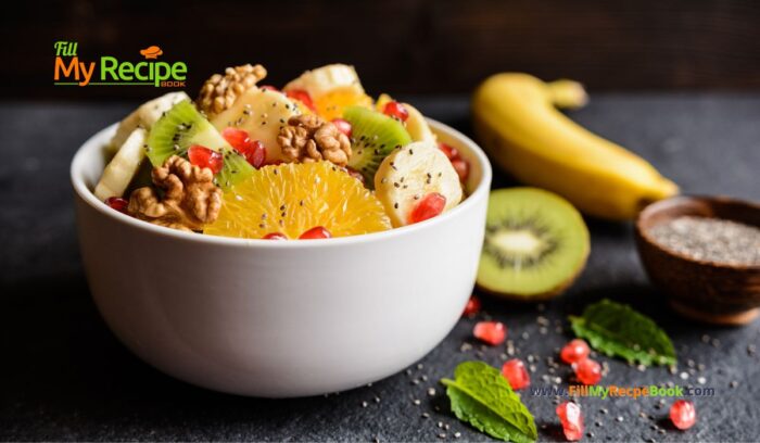 Healthy Kiwi Fruit Salad with Walnuts with pomegranate, orange pieces, banana, chia seeds. An easy recipe idea to create for a winter salad.